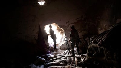 Time for a rest as Free Syrian Army fighters take a break in a storage room in the Karmal Jabl district of Aleppo before more fighting.