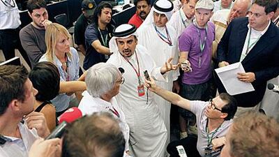 Sheikh Salman bin Hamad Al Khalifa, Bahrain’s crown prince, centre, and, to his left, Bernie Ecclestone, speak to journalists.
