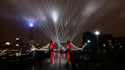 A light show is seen over Tower Bridge on the New Year amid the coronavirus outbreak, in London, Britain. Reuters