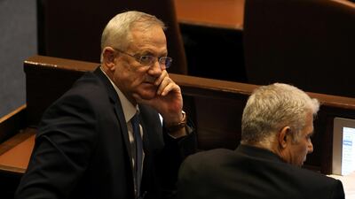Benny Gantz, leader of Blue and White party, and Yair Lapid attend a parliamentary vote for its dissolution and approval of a date for a third national election in less than a year, at the Knesset, or Israel's parliament, in Jerusalem December 11, 2019. REUTERS/Ammar Awad