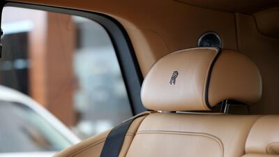 The rear seats can be individually folded down flat at the touch of a button, either from the rear of the car or inside the cabin. Chris Whiteoak / The National