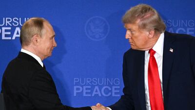 US President Donald Trump, right, and Russian President Vladimir Putin shake hands at the end of a joint press conference after participating in a US-Russia summit on Ukraine at Joint Base Elmendorf-Richardson in Anchorage, Alaska, on August 15. AFP