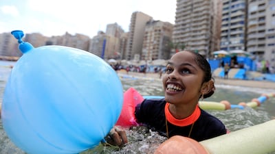 Farah Mohamed, 12, a visually impaired child, enjoys the water at Al Mandara beach, the first 'beach for the blind' in Egypt, on the Mediterranean coast in Alexandria. Reuters