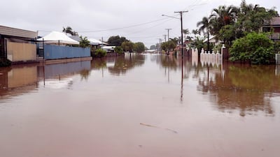 Houses sit in floodwaters. AFP