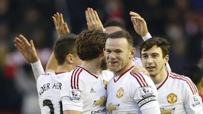 Manchester United's Wayne Rooney, centre, celebrates at full time with teammates. Reuters / Carl Recine