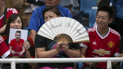 Chinese fans of Manchester United goalkeeper David De Gea. Mark Schiefelbein / AP Photo