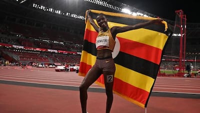 Uganda's Peruth Chemutai celebrates after winning gold in the women's 3000m steeplechase.