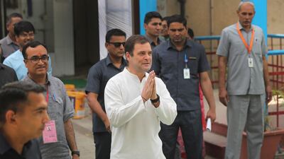 Congress party president Rahul Gandhi, centre, greets media after casting his vote during the sixth phase of general elections in New Delhi, India, on Sunday, May 12, 2019. AP Photo