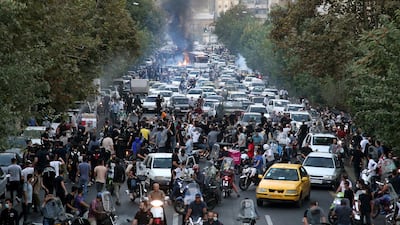 People clash with police during a protest following the death of Mahsa Amini in Tehran, Iran. EPA