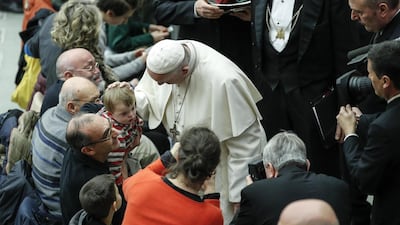 Pope Francis greets the faithful at the Vatican. EPA