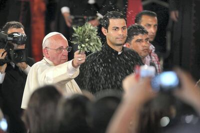 Pope Francis blesses people as he leads a mass in the Latin church near the River Jordan in Bethany, the site of Christ's baptism, west of Amman, Jordan. Jordan Pix /Getty