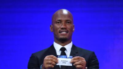 Former Ivorian striker Didier Drogba shows the ticket of Juventus during the Uefa Champions League draw. EPA