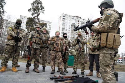 An instructor shows new members of the Territorial Defence Forces how to operate the RPG-7 anti-tank launcher in Kyiv, Ukraine. Reuters