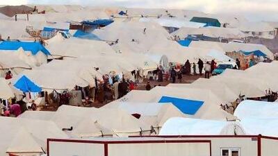 Displaced Syrian refugees seen at a makeshift camp set up along the Turkish border close to the village of Atme in the northwestern province of Idlib. Courtesy AFP