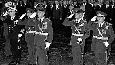 Two of the leaders of Turkey's 1980 coup, Gen Kenan Evren, middle, and Gen Tahsin Sahinkaya, second from right, will be put on trials for their roles in the coup.