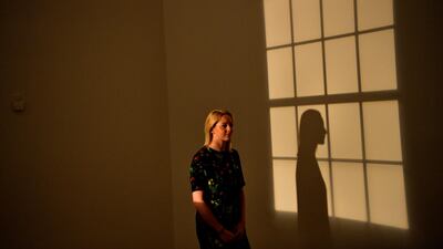 A woman poses with Danish-Icelandic artist Olafur Eliasson's work 'Window Projection' (1991) during a press preview at the Tate Modern in London, Britain, 09 July 2019. Photo: EPA