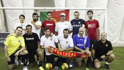 A group of Portugese expats get together every week to play football at the dome on Airport Road in Abu Dhabi. From left to right in back row: Ines Ribeiro, Joao Loureiro, Tiago Neves, Mario Coelho, Rodrigo Silva and Tiago Caldeira; left to right in front row: Victor Gomes, Alexandre Silva, Pedro Coelhoso, Filipe Ferreira, Luis Caetano, Rui Ferro. Lee Hoagland / The National