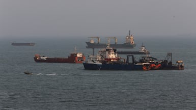 BANDAR ABBAS, IRAN - AUGUST 10: Ships are anchored in the Strait of Hormuz on August 10, 2026 off the coast of Bandar Abbas, Iran. In a recent statement, Iran's Supreme National Security Council said the vital waterway would not reopen until the United States corrects its behavior, demanding that the U.S. end its war on Iran and compensate the country for war damage, among other conditions. Iran has largely halted vessel traffic through the strait with the threat of strikes; meanwhile, the U.S. has imposed a blockade on Iranian ports. (Photo by Ali Saeedi / Getty Images)