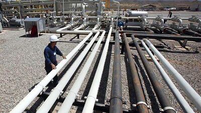 A Tawke oil field employee in the Kurdish region of Iraq. The dispute between Baghdad and Erbil over production and revenue-sharing is showing no signs of resolution. Hadi Mizban / AP Photo
