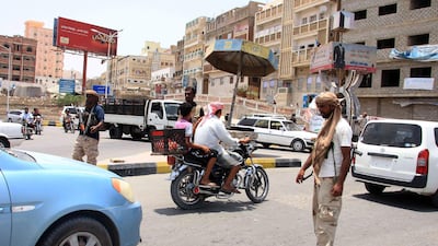 Yemeni security forces inspect vehicles at a checkpoint in Mukalla, the capital of Yemen's southeastern Hadramawt province. AFP