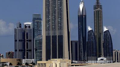 Emirates REIT owns a part of Index Tower, centre, a mixed-use property located in the DIFC. Satish Kumar / The National