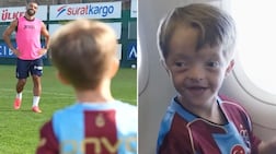 Young Liverpool fan Isaac Kearney reunites with former Liverpool forward Mohamed Salah in Turkey.