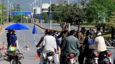 Police divert traffic from a road leading to the Serena hotel in Islamabad, which is expected to host the US delegation during talks with Iran. Reuters