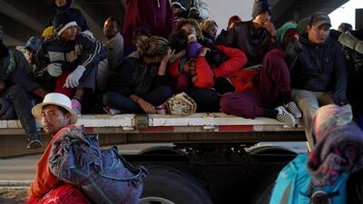 Migrants travel on top of a truck as they make their way to Irapuato from Queretaro, Mexico. Reuters