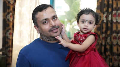 Chandan Sahu with his 18-month-old daughter Deetya at his home in Dubai. Pawan Singh / The National
