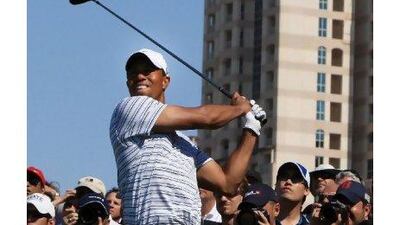 Tiger Woods hits a tee shot during the third round of the Dubai Desert Classic yesterday.