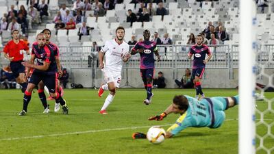 Liverpool's Adam Lallana scores his team's lone goal in their 1-1 draw with Bordeaux in the Europa League on Thursday night. Lee Smith / Action Images / Reuters