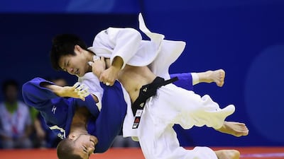 NANJING, CHINA - AUGUST 17: Young players compete in the Men 66kg Quarterfinals on day one of Nanjing 2014 Summer Youth Olympic Games at Longjiang Gymnasium in China. (Photo by Feng Li/Getty Images)