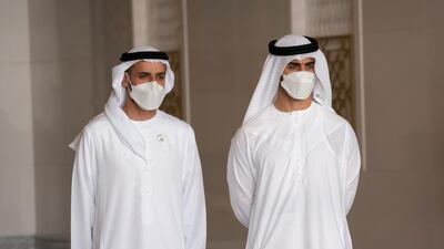 Sheikh Hamdan bin Mohamed bin Zayed, right, and Sheikh Mohamed bin Hamad bin Tahnoon receive Sultan Abdullah Sultan Ahmad Shah, King of Malaysia (not shown), at the Presidential Airport. Mohamed Al Hammadi / Ministry of Presidential Affairs