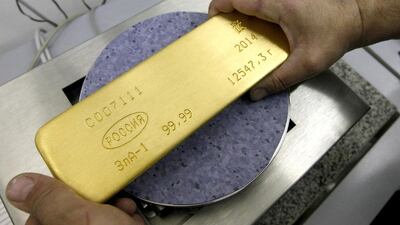 An ingot of 99.99 per cent pure gold. The yellow metal's price has declined. Ilya Naymushin / Reuters