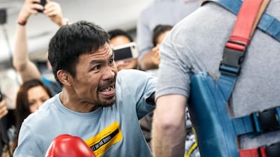 epa07708982 Filipino Senator and professional boxer Manny Pacquiao (L) trains at the Wild Card Boxing gym in Los Angeles, California, USA, 10 July 2019. Pacquiao will fight Keith Thurman on 20 July in Las Vegas. EPA/ETIENNE LAURENT