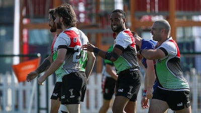 Abu Dhabi Harlequins celebrate a try against Jebel Ali Dragons. Victor Besa / The National