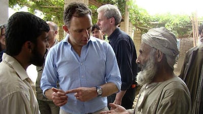 Mark Sedwill, Nato's senior diplomat in Afghanistan, talks to locals in Marjah, Helmand province. Abdul Khaleq / AP