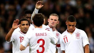 England captain Wayne Rooney celebrates with his teammates after scoring against San Marino