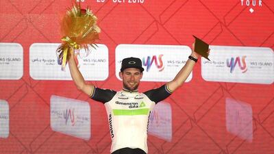 Mark Cavendish of Great Britain and Team Dimension Data celebrates on the podium. Tom Dulat / Getty Images