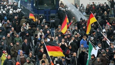 Police drive back protesters at a demonstration by the anti-Islam Pegida movement and right-wing extremist party Pro Koeln in Cologne on January 9, 2016. Roland Wehrauch / EPA