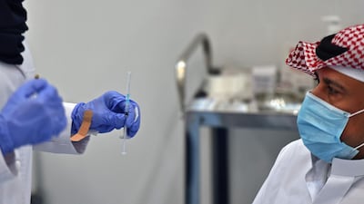The first Saudi citizen prepares to receive the Pfizer-BioNTech vaccine (Tozinameran) in the capital Riyadh. AFP
