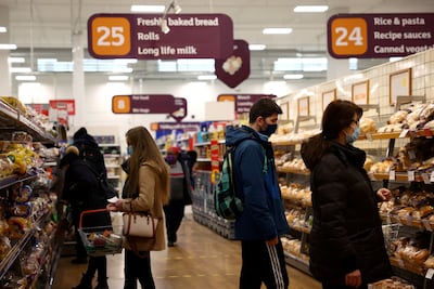 People wearing face masks while shopping at Sainsbury's during January's lockdown in England. Reuters