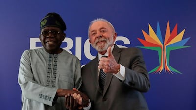 Mr da Silva receives Nigerian President Bola Tinubu. AP