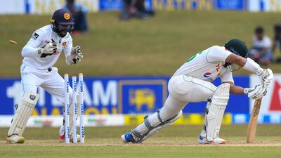 Pakistan's Imam-ul-Haq is clean bowled as Sri Lanka's wicketkeeper Niroshan Dickwella watches. AFP