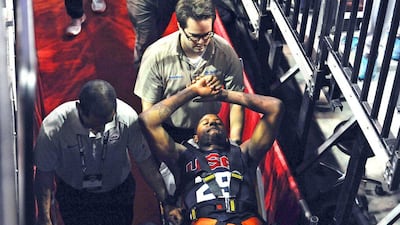 US and Indiana Pacers basketball player Paul George is wheeled out of the building after breaking his right leg during a Team USA intrasquad scrimmage on Friday. Glenn Pinkerton / Las Vegas News Bureau / AP / August 1, 2014