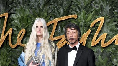 Pierpaolo Piccioli of Valentino looks dapper in a suit, while model Kirsten McMenemy wears Valentino. Getty