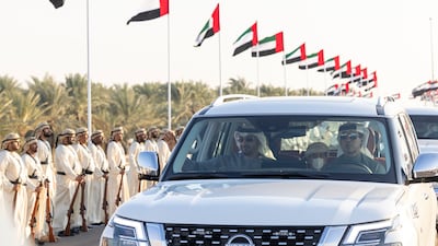 Sheikh Mohamed and Sheikh Mansour bin Zayed, Deputy Prime Minister and Minister of the Presidential Court, arrive at the Sheikh Zayed Heritage Festival to attend the Union Parade. Ryan Carter / Presidential Court