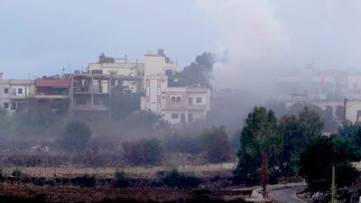 Smoke rises from artillery shell that hit the houses of Aita al-Shaab a Lebanese border village with Israel, south Lebanon, Sunday, Oct. 15, 2023. (AP Photo / Hussein Malla)