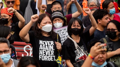 Filipino activists raise their fists during a protest in observance of Human Rights Day, in Manila, Philippines, December 10, 2022. REUTERS / Lisa Marie David