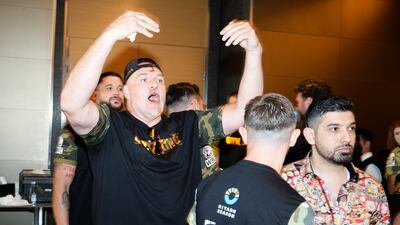 John Fury taunts members of Oleksandr Usyk's team following an earlier fracas. PA